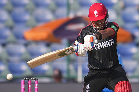 Canada's Harsh Thaker plays a shot during the T20 World Cup cricket match between Canada and United Arab Emirates in New Delhi.