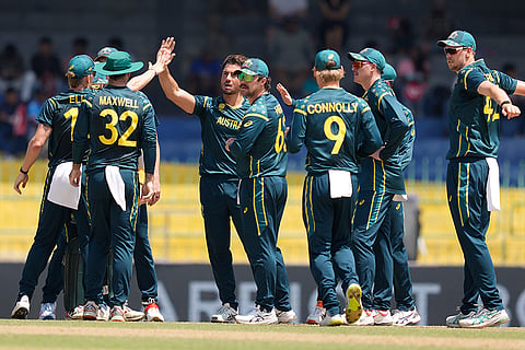 Australia's Marcus Stoinis, center left, celebrates with teammates the wicket of Zimbabwe's Tadiwanashe Marumani during the T20 World Cup cricket match between Australia and Zimbabwe in Colombo, Sri Lanka.