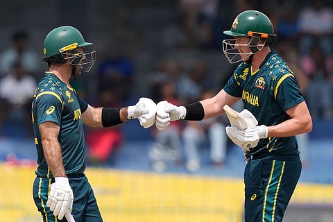 Australia's Glenn Maxwell, left, and Matthew Renshaw greets each other during the T20 World Cup cricket match between Australia and Zimbabwe in Colombo, Sri Lanka.