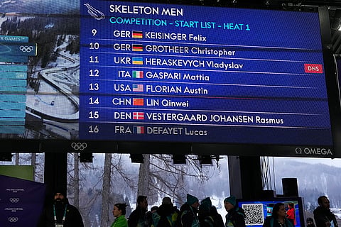 A scoreboard, that indicates that Ukrainian skeleton athlete Vladyslav Heraskevych did not start, is seen at the 2026 Winter Olympics, in Cortina d'Ampezzo, Italy.
