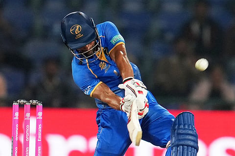 United Arab Emirates' Sohaib Khan hits a six during the T20 World Cup cricket match between Canada and United Arab Emirates in New Delhi.