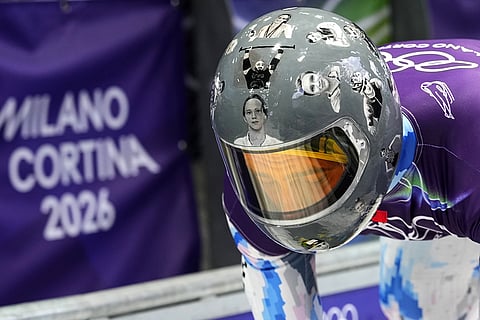 Ukraine's Vladyslav Heraskevych arrives at the finish during a men's skeleton training session at the 2026 Winter Olympics, in Cortina d'Ampezzo, Italy.