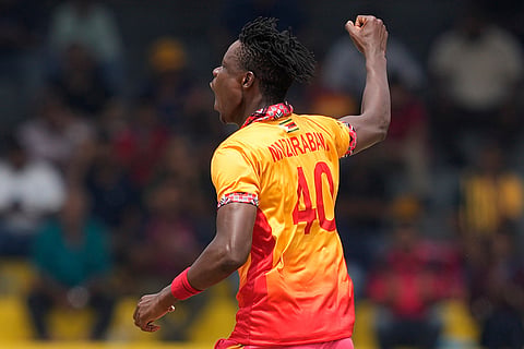 Zimbabwe's Blessing Muzarabani celebrates the wicket of Australia's Tim David during the T20 World Cup cricket match between Australia and Zimbabwe in Colombo, Sri Lanka.