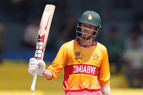 Zimbabwe's Brian Bennett celebrates his fifty runs during the T20 World Cup cricket match between Australia and Zimbabwe in Colombo, Sri Lanka.