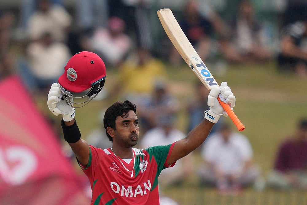 Omans Syed Aamir Kaleem celebrates his fifty runs 