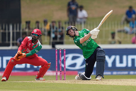 Ireland's George Dockrell plays a shot during the T20 World Cup cricket match between Ireland and Oman in Colombo, Sri Lanka.