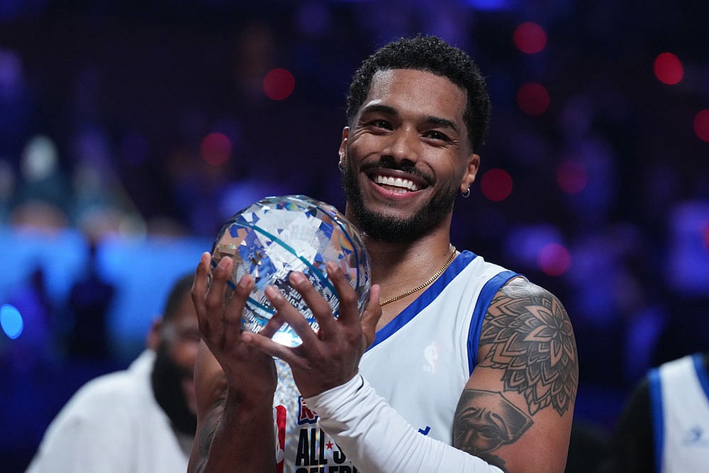 | Photo: AP/Jae C. Hong : Rome Flynn poses with a trophy after he was named MVP in an NBA basketball's All-Star Celebrity Game  in Inglewood, Calif.