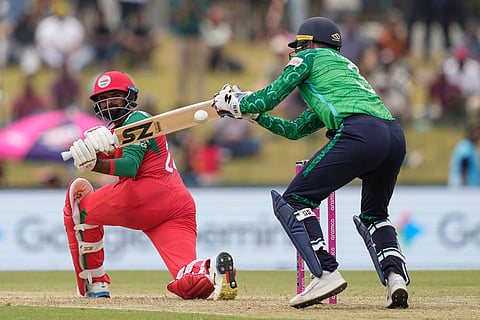 Oman's Ashish Odedara plays a shot during the T20 World Cup cricket match between Ireland and Oman in Colombo, Sri Lanka.