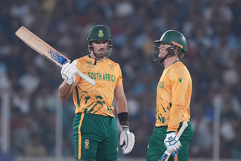 South Africa's captain Aiden Markram, left, celebrates his fifty runs during the T20 World Cup cricket match between South Africa and New Zealand in Ahmedabad.
