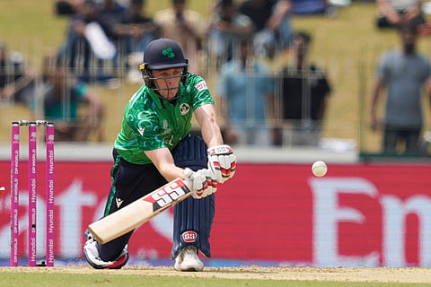 Ireland's Lorcan Tucker plays a shot during the T20 World Cup cricket match between Ireland and Oman in Colombo, Sri Lanka.