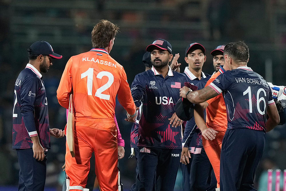 | Photo: AP/Mahesh Kumar A : United States' captain Monank Patel, centre, shake hands with Netherlands' Fred Klaassen after they won the T20 World Cup cricket match against Netherlands in Chennai, India.