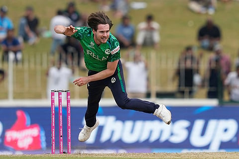 Ireland's Josh Little bowls a delivery during the T20 World Cup cricket match between Ireland and Oman in Colombo, Sri Lanka.