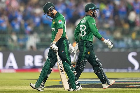 Pakistan's captain Salman Ali Agha, left, leaves the ground after losing his wicket as teammate Usman Khan walks in during the T20 World Cup cricket match between India and Pakistan in Colombo, Sri Lanka.