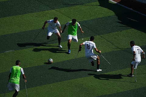 Palestinian amputee soccer players train on a newly built field in Gaza City.