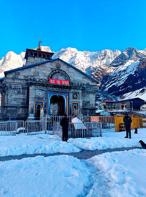Security personnel stand guard at the snow-laden Kedarnath Temple complex, in Rudraprayag district, Uttarakhand. The portals of the revered temple in the Garhwal Himalayas of Uttarakhand will reopen for devotees on April 22 after remaining closed for nearly six months during winter, a temple committee official said on Sunday. 