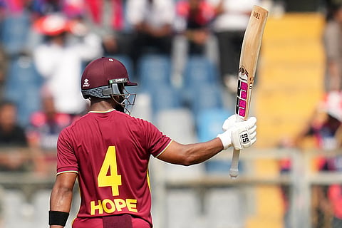 West Indies' captain Shai Hope celebrates his fifty runs during the T20 World Cup cricket match between Nepal and West Indies in Mumbai.