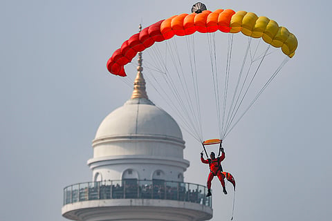 A Nepali Army paratrooper performs a free fall during the 263rd Army Day and Maha Shivaratri celebrations at the Army Pavilion, in Kathmandu, Nepal.
