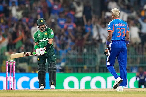 India's Hardik Pandya, right, celebrates the wicket of Pakistan's Sahibzada Farhan, right, during the T20 World Cup cricket match between India and Pakistan in Colombo, Sri Lanka.