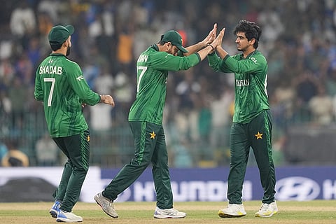 Pakistani players celebrate the wicket of India's Hardik Pandya during the T20 World Cup cricket match between India and Pakistan in Colombo, Sri Lanka.