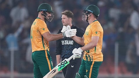 South Africa's captain Aiden Markram, left, and South Africa's David Miller, right, celebrates after they won the the T20 World Cup cricket match against New Zealand in Ahmedabad.