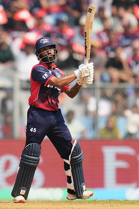 Nepal's Dipendra Singh Airee hits a six during the T20 World Cup cricket match between Nepal and West Indies in Mumbai.