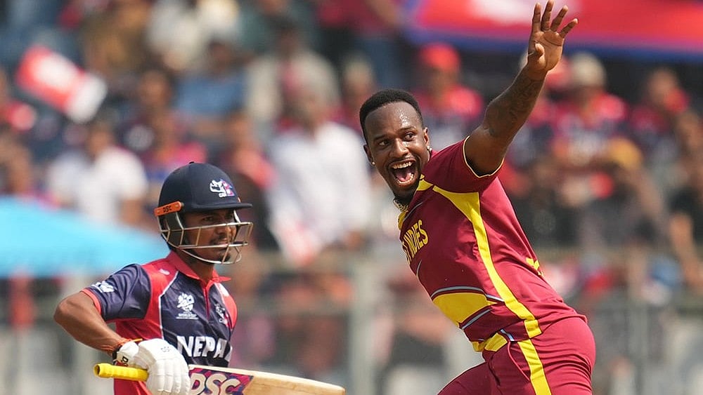 | Photo: AP/Rafiq Maqbool : Matthew Forde appeals successfully for the wicket of Rohit Paudel during the T20 World Cup cricket match between Nepal and West Indies in Mumbai.