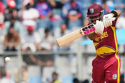 West Indies' captain Shai Hope plays a shot during the T20 World Cup cricket match between Nepal and West Indies in Mumbai.