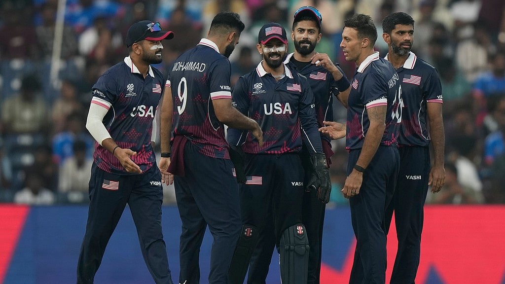 Photo: AP : United States' Shadley Van Schalkwyk, second right, celebrates with teammates the wicket of Namibia's captain Gerhard Erasmus during their T20 World Cup cricket match in Chennai.