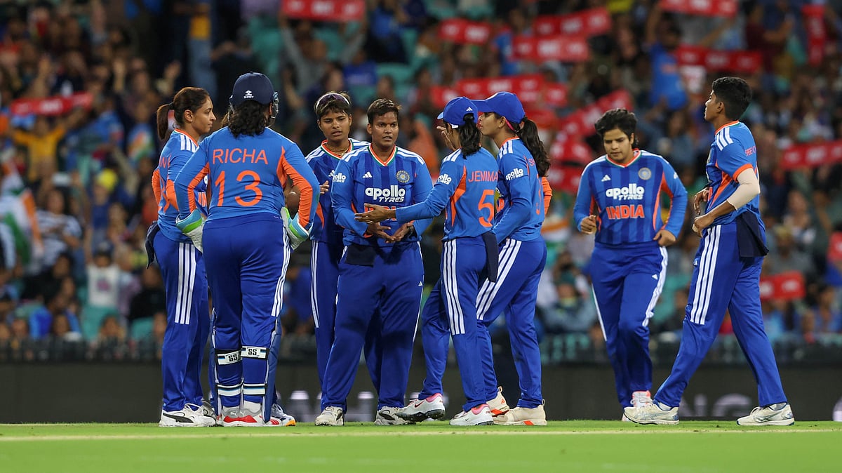| Photo: X/BCCIWomen : India players celebrate a wicket during the first T20I match against Australia on February 15, 2026.