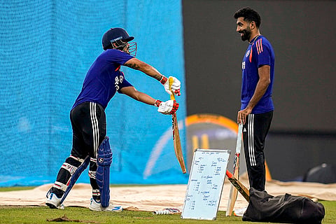 India's Ishan Kishan and Jasprit Bumrah during a practice session ahead of an ICC Men's T20 World Cup 2026 cricket match between India and Pakistan, at R Premadasa Stadium, in Colombo.