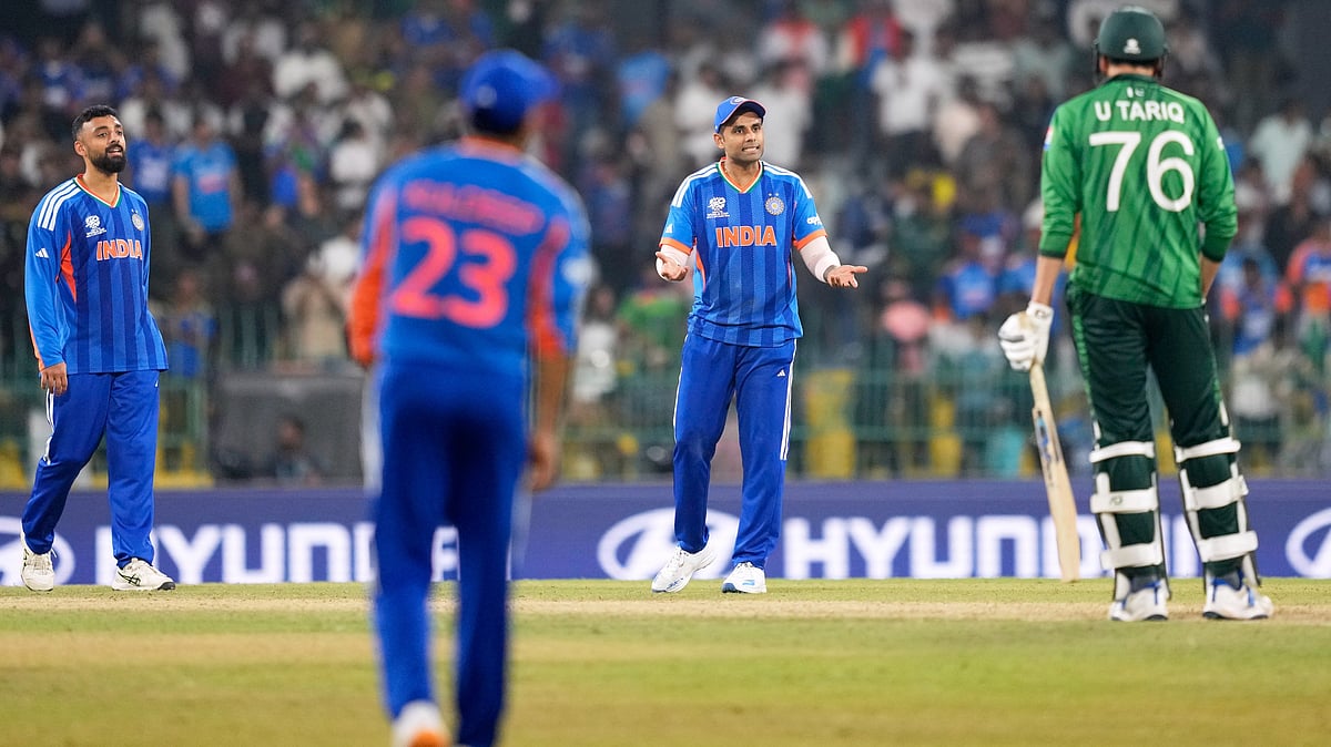 AP : ndia's captain Suryakumar Yadav, second right, consults teammate Ishan Kishan, unseen, as he decides whether to take a review for the wicket of Pakistan's Usman Tariq, right, during the T20 World Cup cricket match between India and Pakistan in Colombo, Sri Lanka, Sunday, Feb. 15, 2026