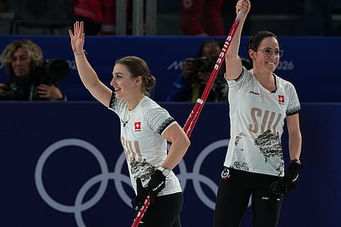Switzerland's Selina Witschonke and Carole Howald react after the women's curling round robin session against Canada at the 2026 Winter Olympics, in Cortina d'Ampezzo, Italy.