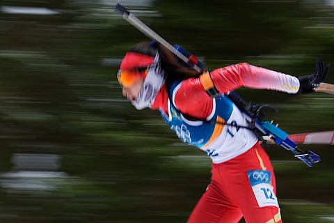 Meng Fanqi, of China, competes during the women's 7.5-kilometer sprint biathlon race at the 2026 Winter Olympics in Anterselva, Italy.