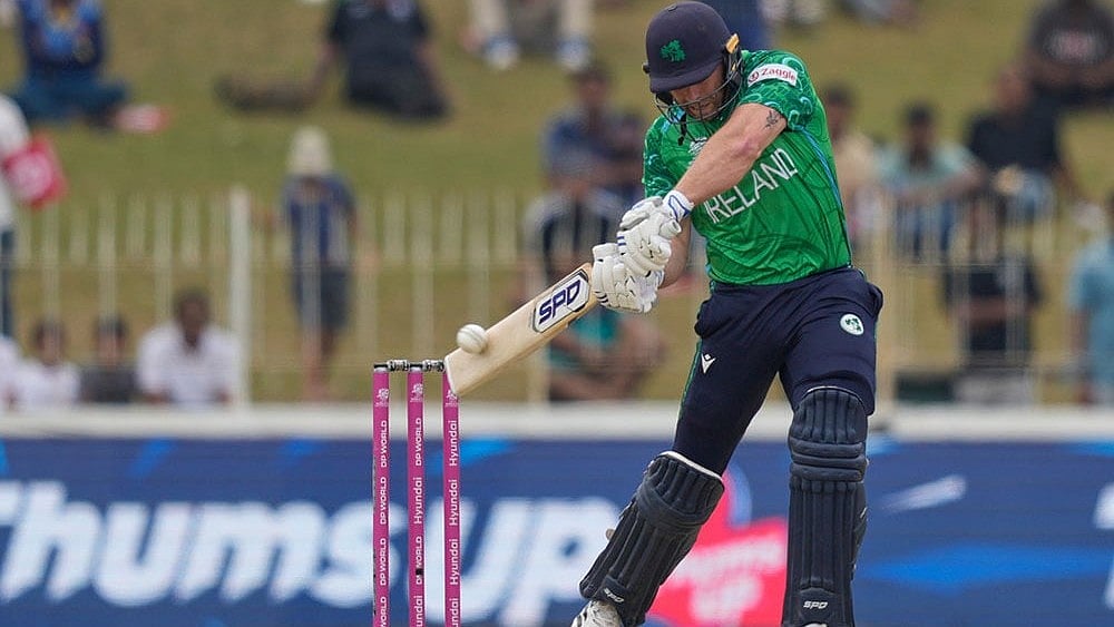 | Photo: AP/Eranga Jayawardena : Ireland's Ross Adair plays a shot during the T20 World Cup cricket match between Ireland and Oman in Colombo, Sri Lanka.