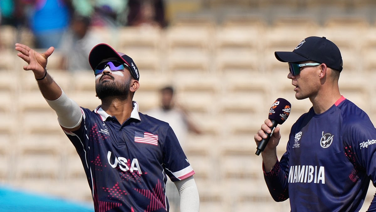 (AP Photo/Mahesh Kumar A.) : United States' captain Monank Patel, left, toss a coin as Namibia's captain Gerhard Erasmus watch during the T20 World Cup cricket match between Namibia and USA in Chennai, India, Sunday, Feb. 15, 2026