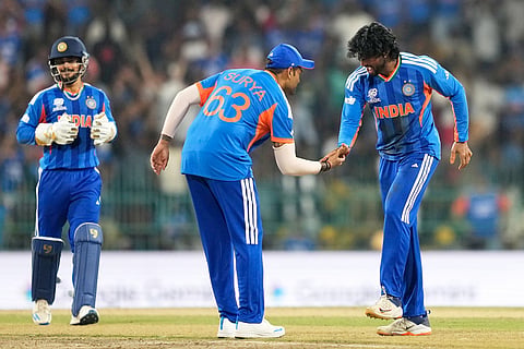 India's Tilak Varma, right, and captain Suryakumar Yadav celebrate the wicket of Pakistan's Shadab Khan during the T20 World Cup cricket match between India and Pakistan in Colombo, Sri Lanka.