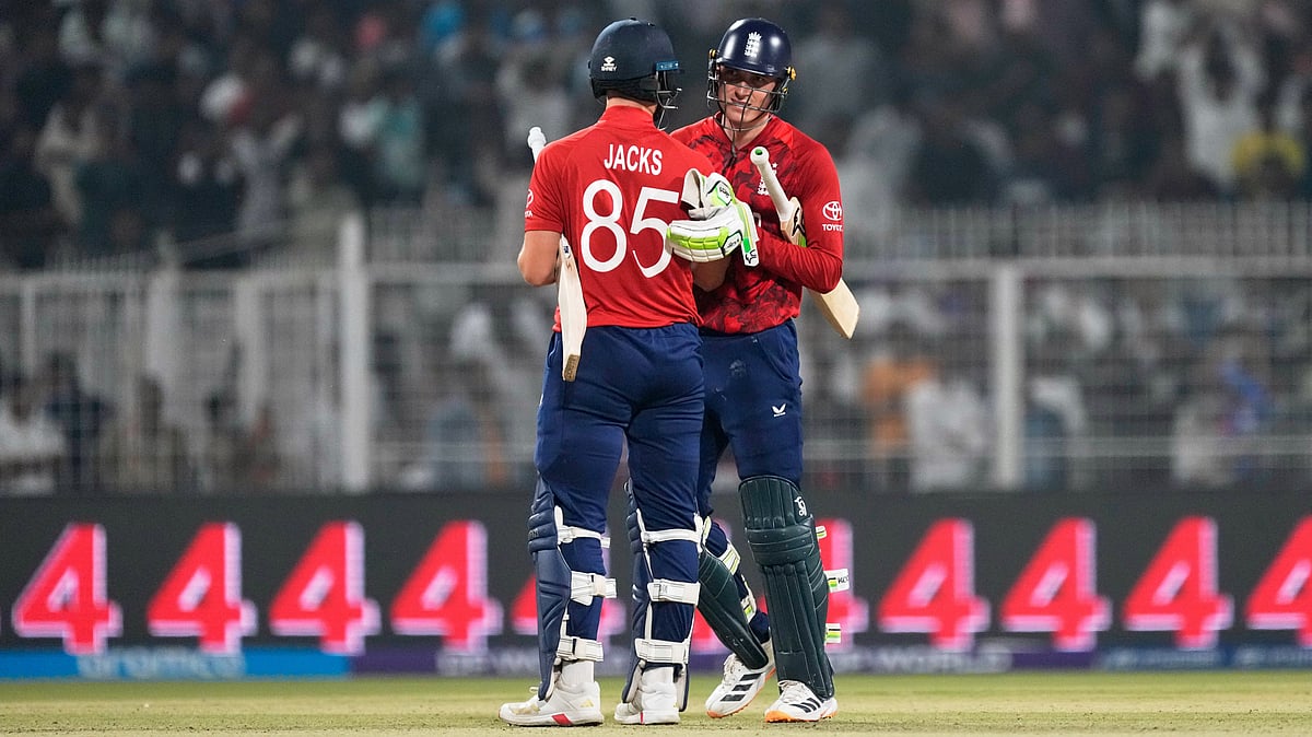 | Photo: AP/Bikas Das : England's Will Jacks, left, and batting partner Tom Banton celebrate after England won the T20 World Cup cricket match against Scotland in Kolkata, India, Saturday, Feb. 14, 2026.