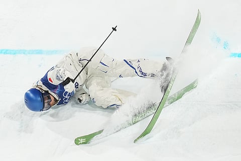 China's Eileen Gu crashes as she competes in the women's freestyle skiing big air qualifications at the 2026 Winter Olympics, in Livigno, Italy.