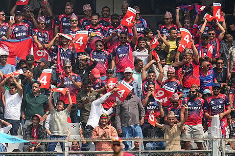 Nepal's cricket fans cheer for their team during the T20 World Cup cricket match between Nepal and West Indies in Mumbai.