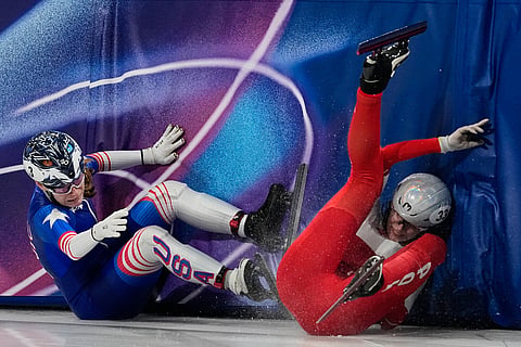 Corinne Stoddard of the United States crashes into Gabriela Topolska of Poland in the quarterfinals of the women's 1000 meter short track speed skating at the 2026 Winter Olympics, in Milan, Italy.