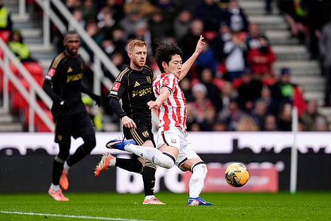Stoke City's Bae Jun-Ho, right, scores his side's first goal during the English FA Cup fourth round match between Stoke City and Fulham, in Stoke, England.