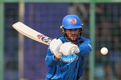 Afghanistan's Azmatullah Omarzai plays a shot during the T20 World Cup cricket match between Afghanistan and United Arab Emirates in New Delhi.
