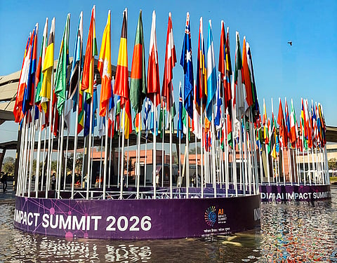 National flags of various countries at Bharat Mandapam during the India AI Impact Summit 2026, in New Delhi.