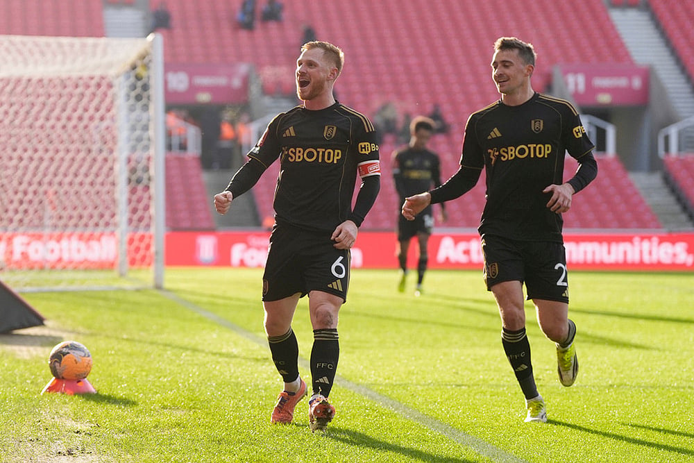 | Photo: Nick Potts/PA via AP : Fulham's Harrison Reed, left, celebrates with Timothy Castagne after scoring his sides second goal  during the English FA Cup fourth round match between Stoke City and Fulham, in Stoke, England.