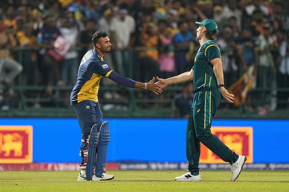 | Photo: AP/Eranga Jayawardena : Sri Lanka's captain Dasun Shanaka, left, shake hands with Australia's captain Mitchell Marsh after they won the T20 World Cup cricket match against Australia in Pallekele, Sri Lanka.