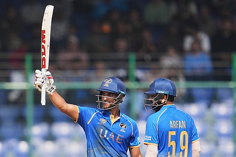 United Arab Emirates' Sohaib Khan celebrates his fifty runs during the T20 World Cup cricket match between Afghanistan and United Arab Emirates in New Delhi.
