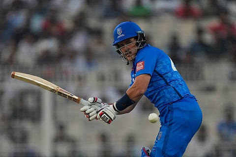 Italy's Benjamin Manenti plays a shot during the T20 World Cup cricket match between England and Italy in Kolkata, India.