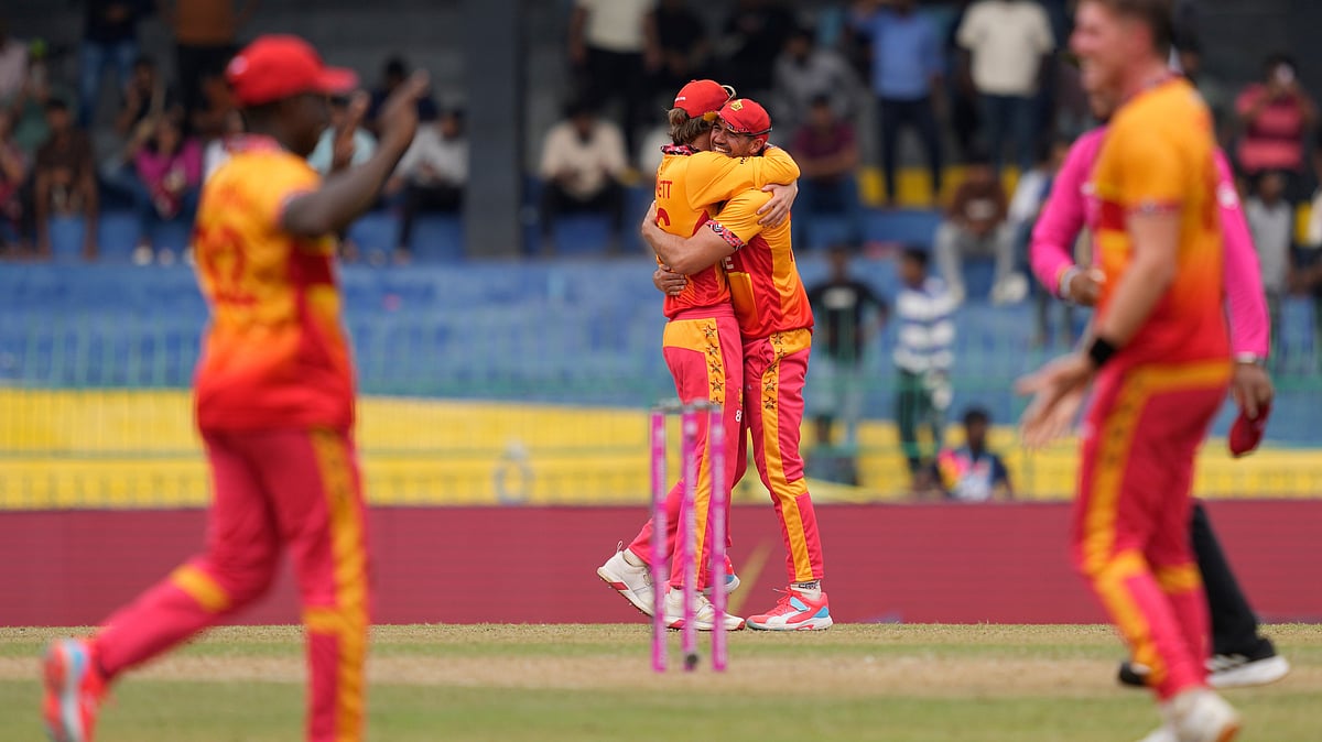 | Photo: AP/Eranga Jayawardena : Zimbabwe's players celebrates after won the T20 World Cup cricket match against Australia in Colombo, Sri Lanka, Friday, Feb. 13, 2026.