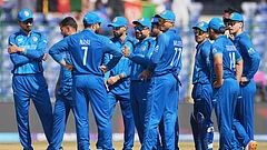Afghanistan's captain Rashid Khan, centre, celebrates with teammates the wicket of United Arab Emirates' Aryansh Sharma during the T20 World Cup cricket match between Afghanistan and United Arab Emirates in New Delhi, India, Monday, Feb. 16, 2026. - (AP Photo/Manish Swarup)