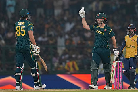 Australia's captain Mitchell Marsh celebrates his fifty runs during the T20 World Cup cricket match between Sri Lanka and Australia in Pallekele, Sri Lanka.